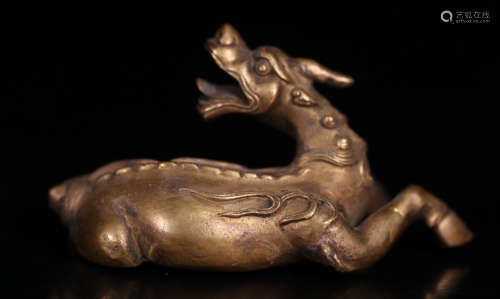 A BRONZE CASTED RHINOCEROS SHAPED PENDANT
