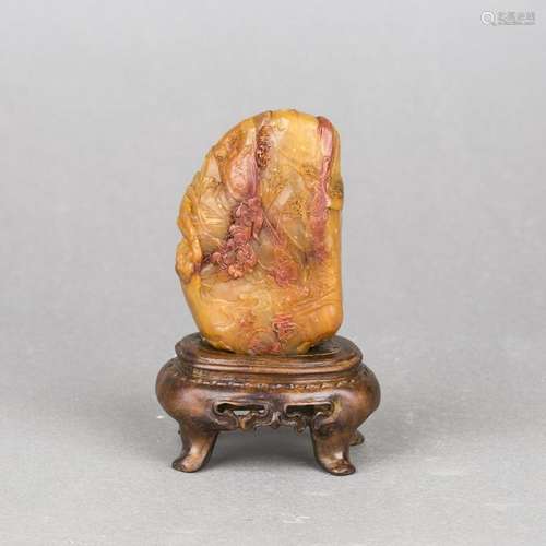 A SHOUSHAN SOAPSTONE CARVING WITH HARDWOOD STAND