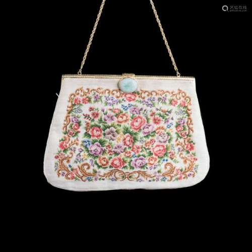 A CHINESE EMBROIDED HANDBAG MOUNTED WITH JADEITE