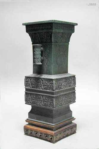 A CHINESE ARCHAISTIC BRONZE BEAKER VASE