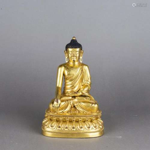 A GILT-BRONZE FIGURE OF BUDDHA SHAKYAMUNI