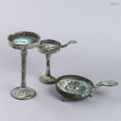 A GROUP OF THREE ANTIQUE BRONZE OIL LAMPS