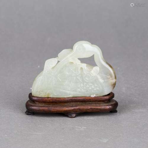 A WHITE JADE CARVING OF SWAN WITH HARDWOOD STAND