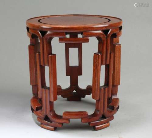 A Raised Wooden Round Stand