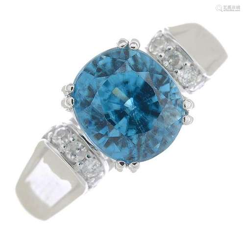 A blue zircon and diamond dress ring.Zircon calculated