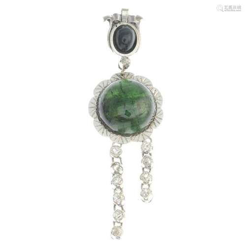 A cat's-eye tourmaline and diamond pendant. Estimated