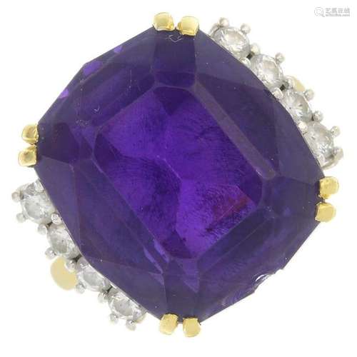 An 18ct gold amethyst and diamond dress ring.Amethyst