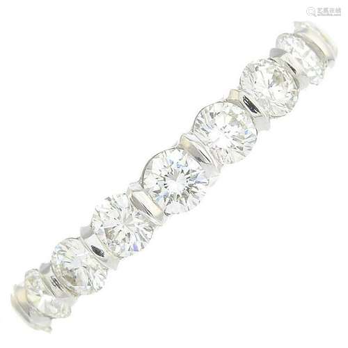 A platinum diamond half eternity ring. Estimated total