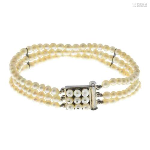 A natural pearl multi-strand bracelet, with push-piece