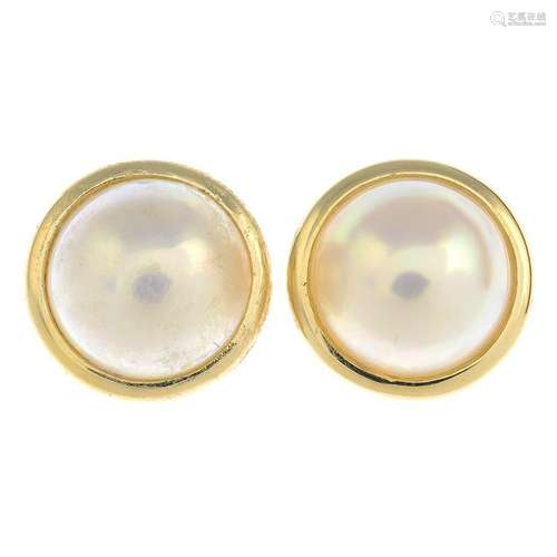 A pair of 14ct gold mabe pearl earrings.Hallmarks for