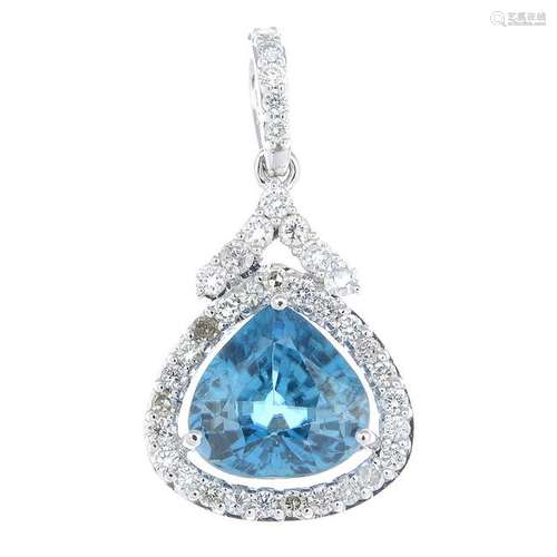 A blue zircon and diamond cluster pendant.Zircon