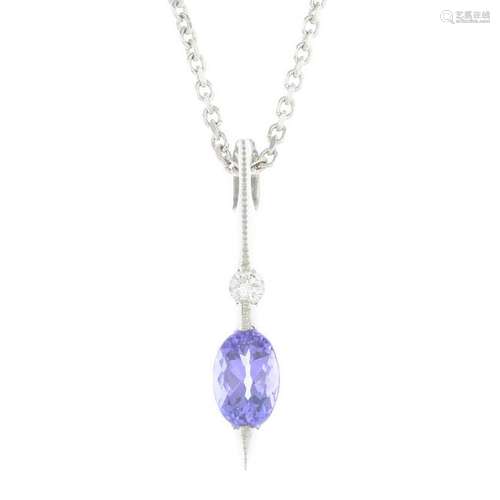 An 18ct gold tanzanite and diamond pendant, suspended