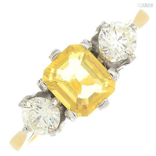 A yellow sapphire and diamond three-stone ring.Sapphire