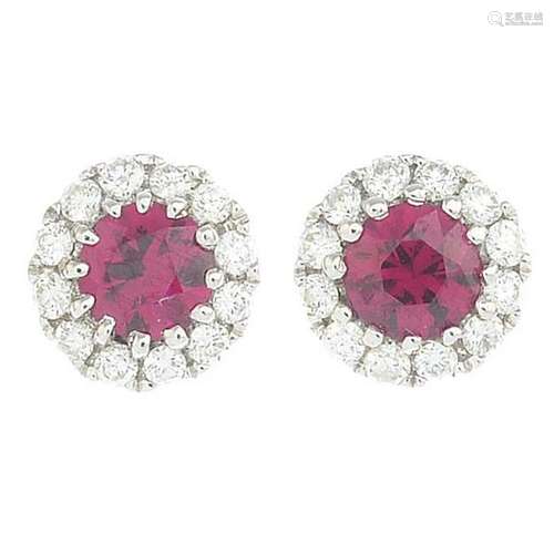 A pair of ruby and diamond cluster earrings.Total ruby