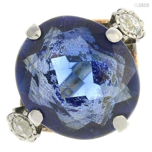 A synthetic sapphire and diamond three-stone