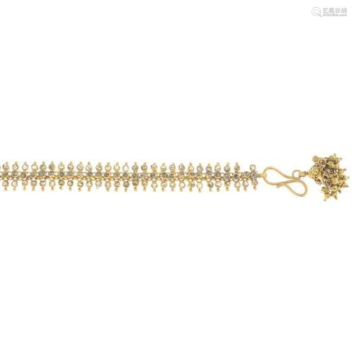 A diamond bracelet, with charm. Length 20cms. 17.9gms.