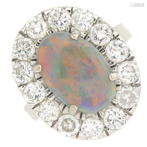 An 18ct gold opal and diamond cluster ring.Estimated