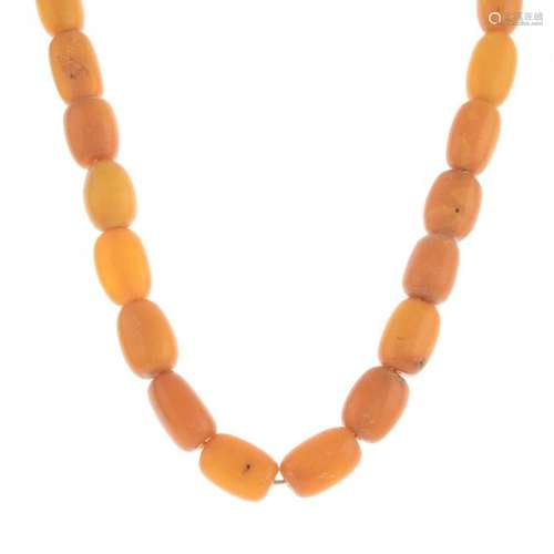 An amber bead necklace.Amber beads, measuring