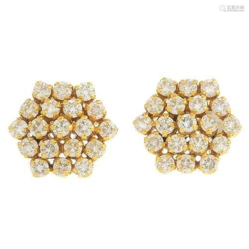 A pair of diamond cluster earrings.Estimated total