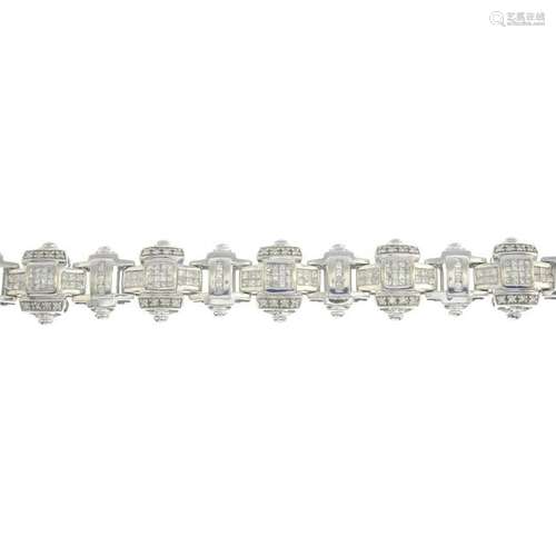 A 9ct gold diamond geometric link bracelet. Total