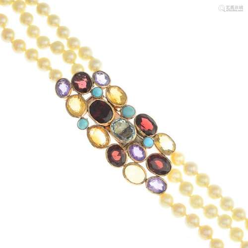 A cultured pearl three-row necklace. Comprising