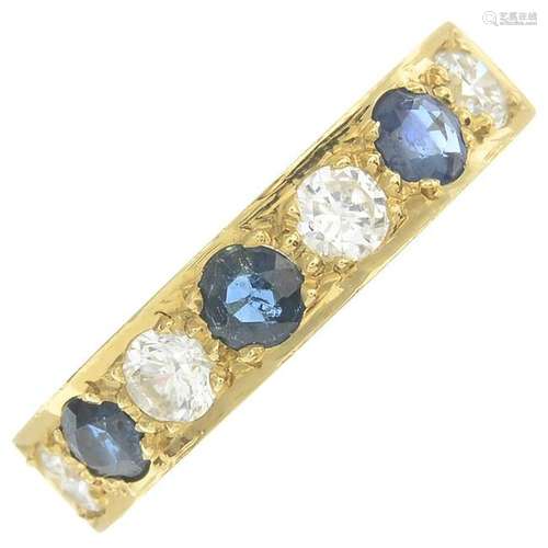 An 18ct gold sapphire and diamond half eternity ring.