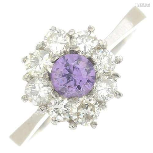 A diamond and amethyst cluster ring.Estimated total