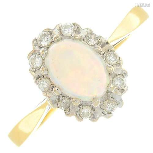 An opal and diamond cluster ring. Estimated total