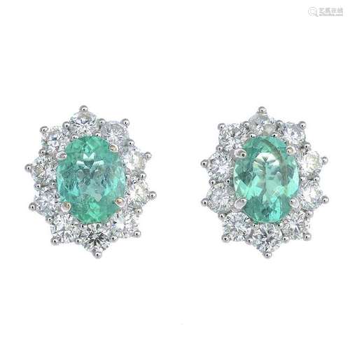 A pair of emerald and diamond cluster