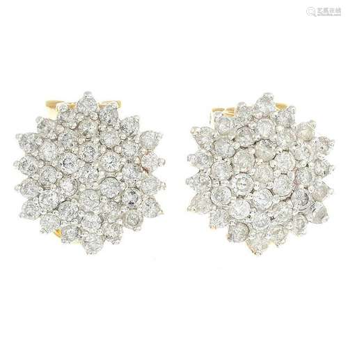 A pair of 18ct gold diamond cluster earrings.Total