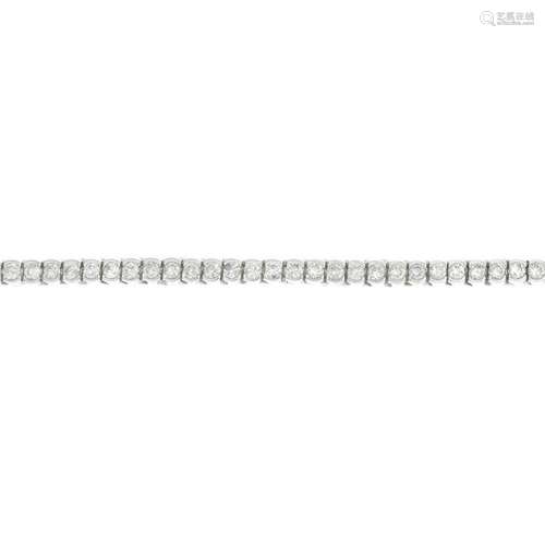 A diamond line bracelet.Estimated total diamond weight