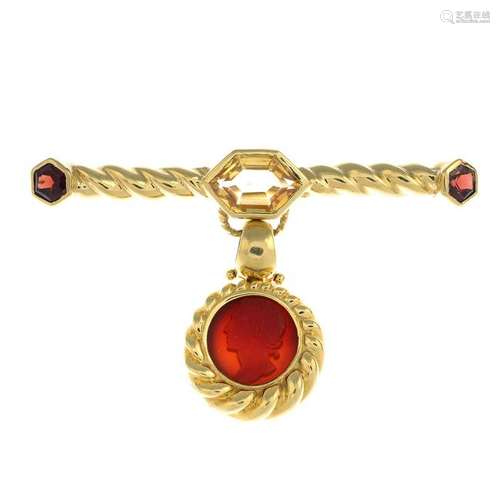 An 18ct gold citrine and garnet brooch, suspending a