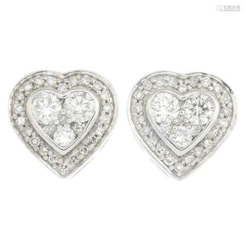 A pair of diamond cluster earrings.Estimated total