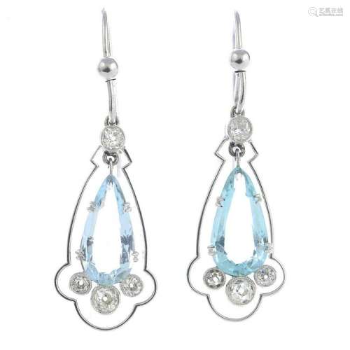 A pair of aquamarine and diamond earrings.Aquamarine
