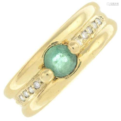 An emerald and diamond ring. Emerald calculated weight