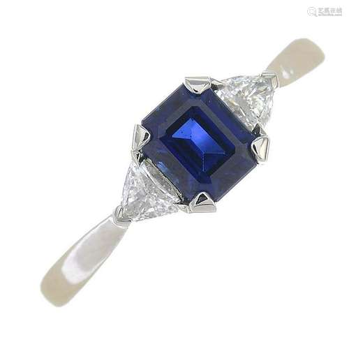 A sapphire and diamond three-stone ring.Estimated total