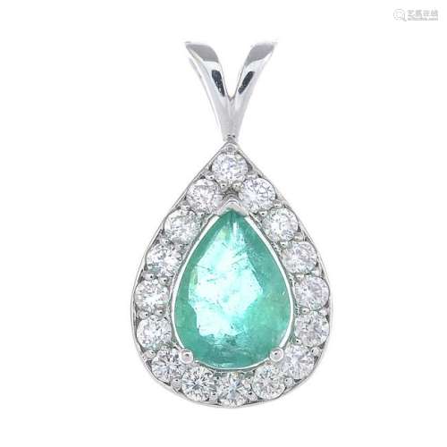 An emerald and diamond cluster pendant. Emerald