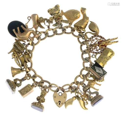 A 9ct gold bracelet with variously designed charms