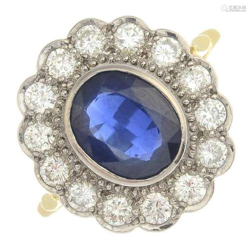 A sapphire and diamond cluster ring. Estimated total