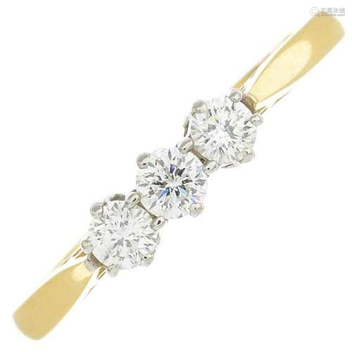 An 18ct gold diamond three-stone ring.Estimated total