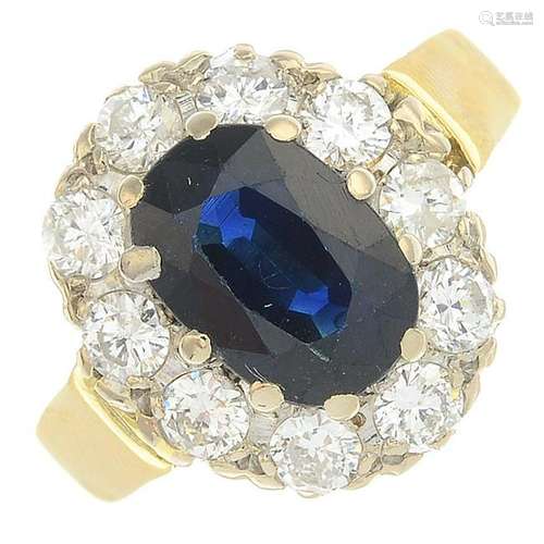 A sapphire and diamond cluster ring. Sapphire