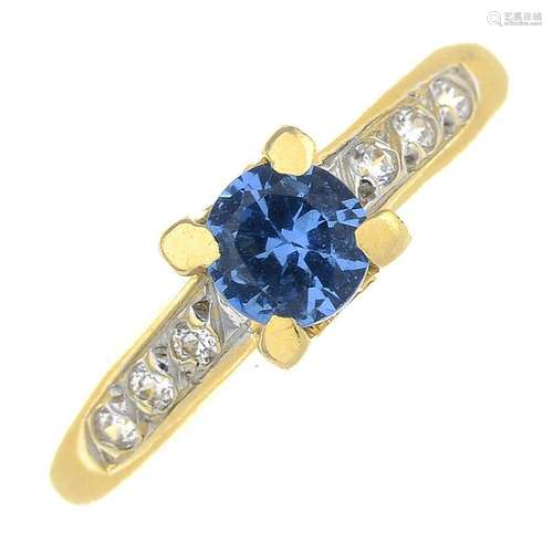 A synthetic blue spinel and diamond ring.Estimated