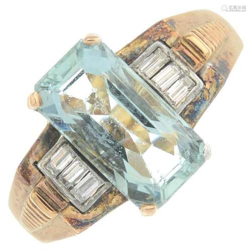 An aquamarine and diamond dress ring.Aquamarine