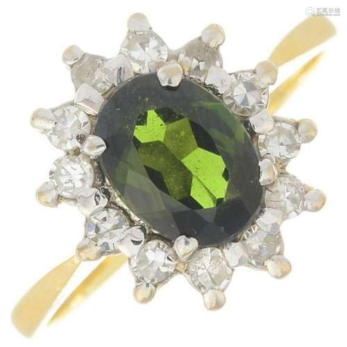 An 18ct gold green tourmaline and diamond cluster ring.