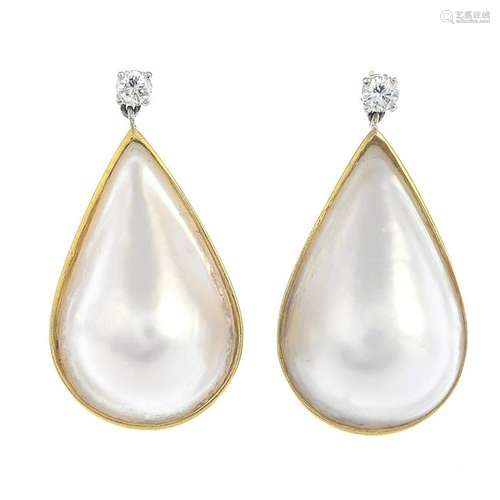 A pair of mabe pearl and diamond earrings.Estimated