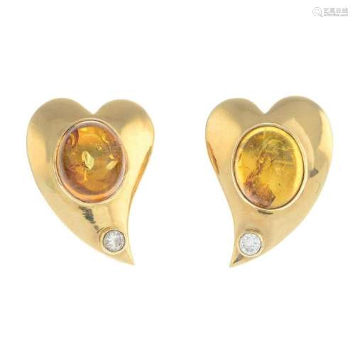 A pair of amber and diamond earrings. Estimated total