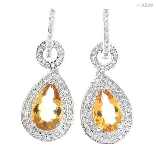 A pair of citrine and diamond cluster earrings.One