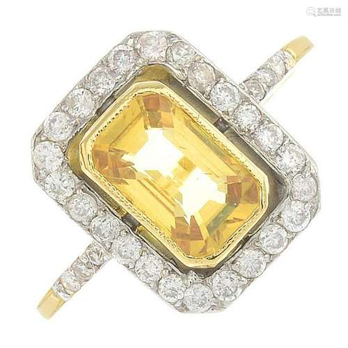 A yellow sapphire and diamond cluster ring.Sapphire