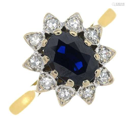 An 18ct gold sapphire and diamond cluster ring.