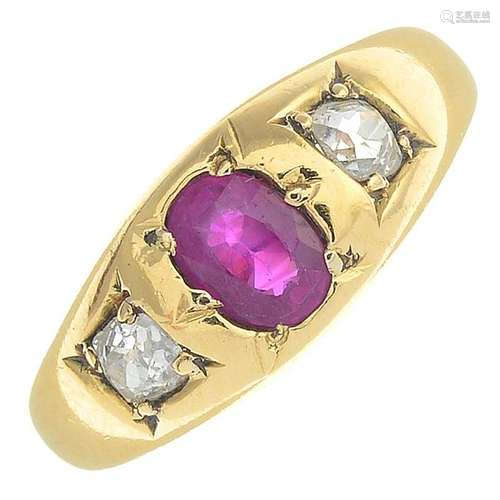 An 18ct gold ruby and diamond three-stone ring.